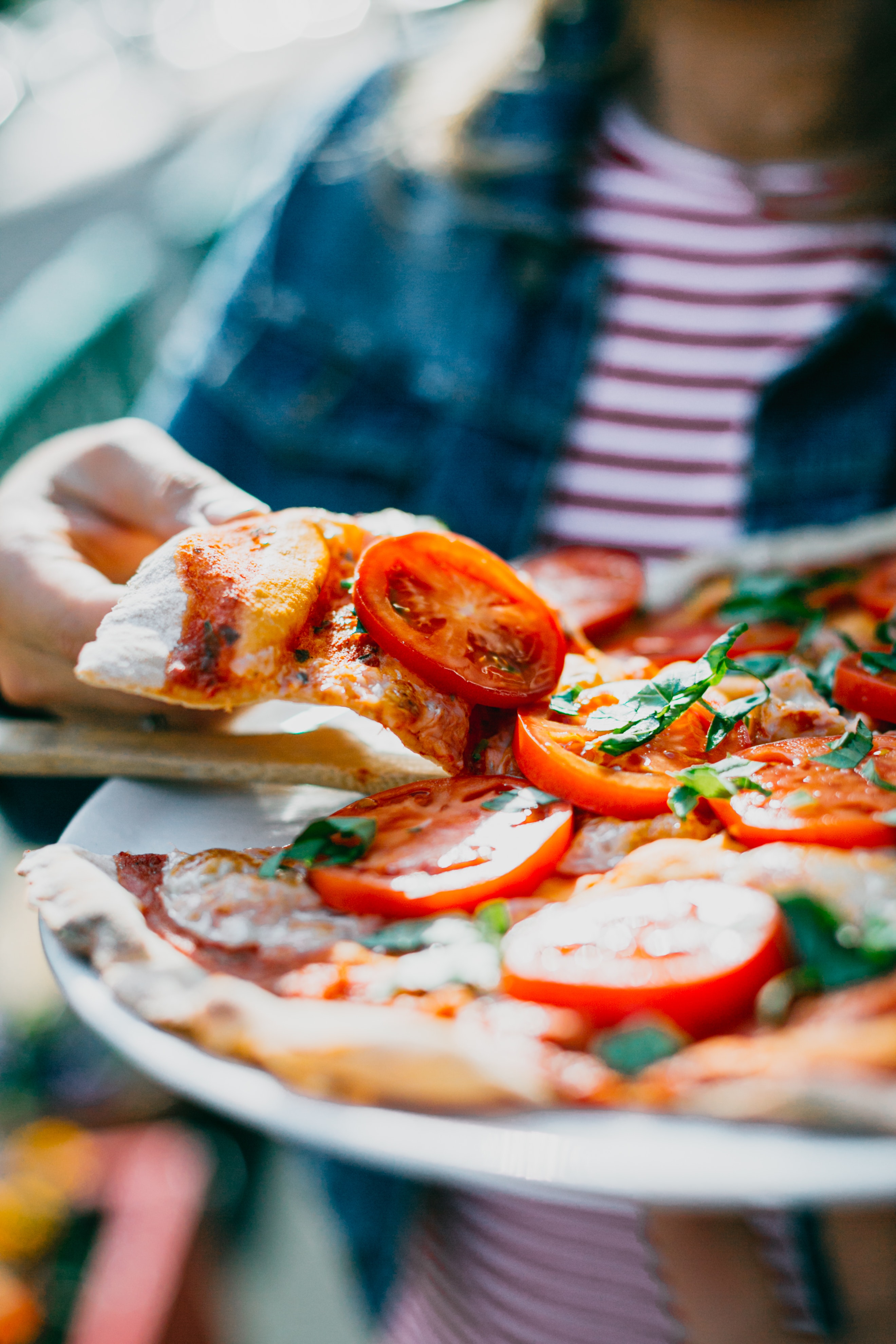 Woman holding Pizza